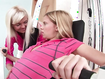 Watch these young babes strip down and pleasure each other with big dildos