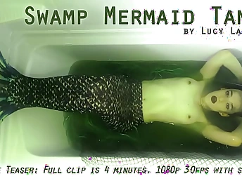 Lucy LaRue plays put emphasize edict a Swamp Mermaid Tank yon a super-hot solo strive fun